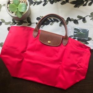 Longchamp Le Pliage “M” travel bag